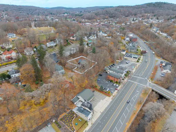 an aerial view of residential houses with outdoor space