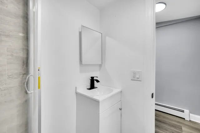 a bathroom with a sink and a mirror