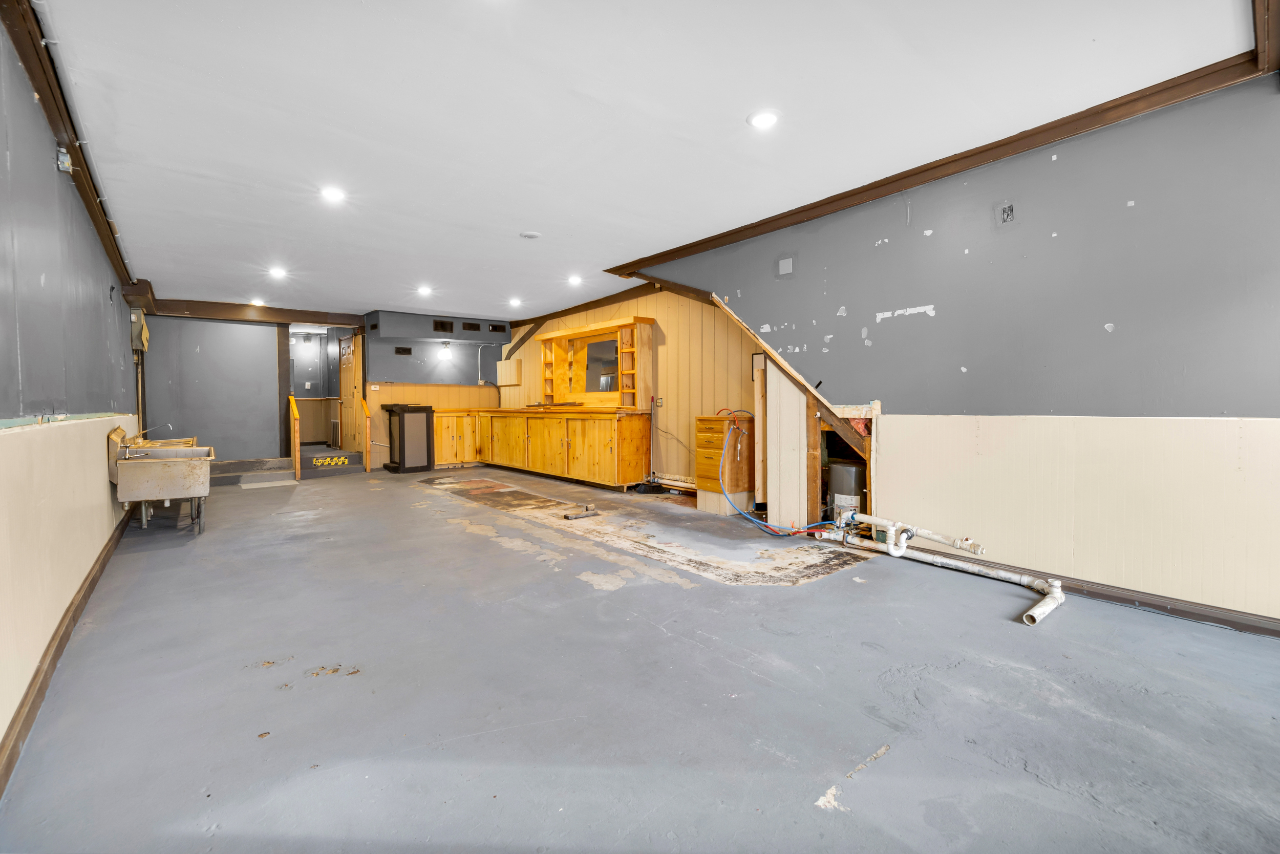 720 Main Street Winchester, CT 06098 - Photo 5 of 38 a view of a hall with a car park table and chair