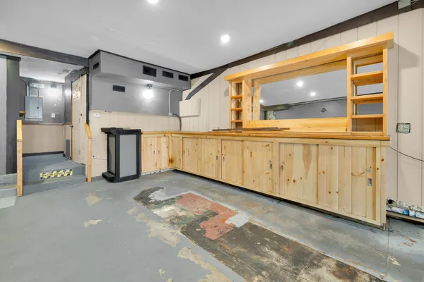 a view of a refrigerator in an empty room