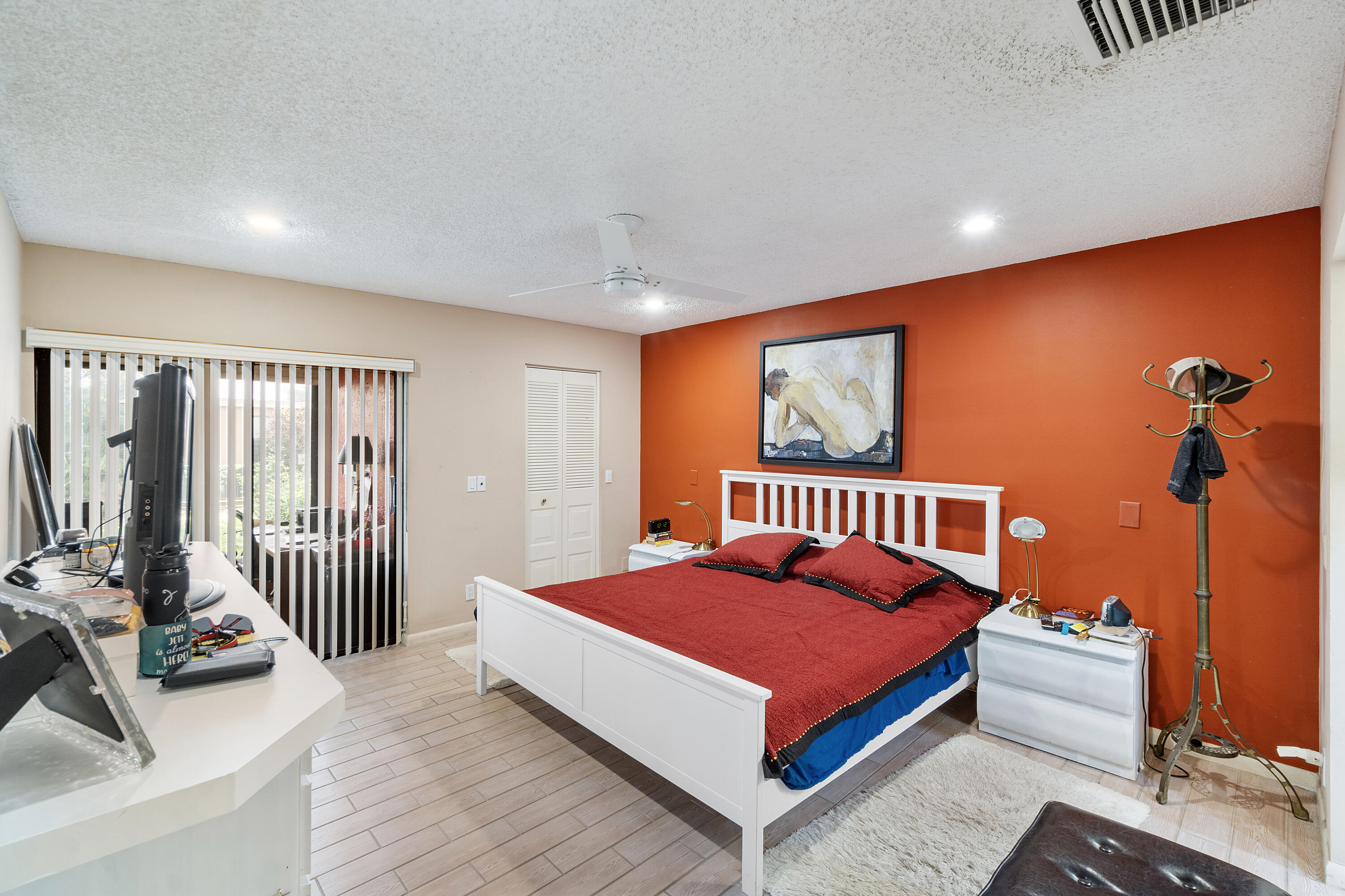 10900 Waterberry Court Boca Raton, FL 33498 - Photo 14 of 28 a bedroom with a bed and glass window