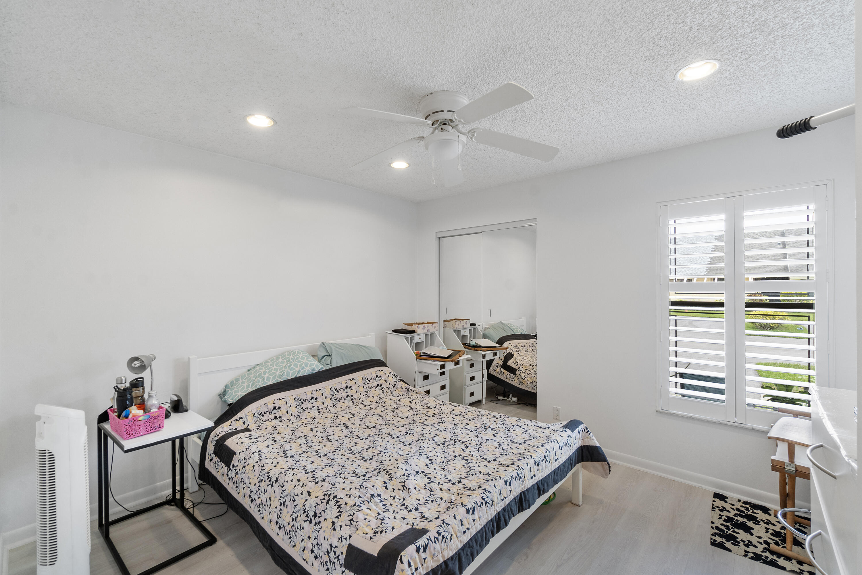10900 Waterberry Court Boca Raton, FL 33498 - Photo 17 of 28 a bedroom with a bed and window
