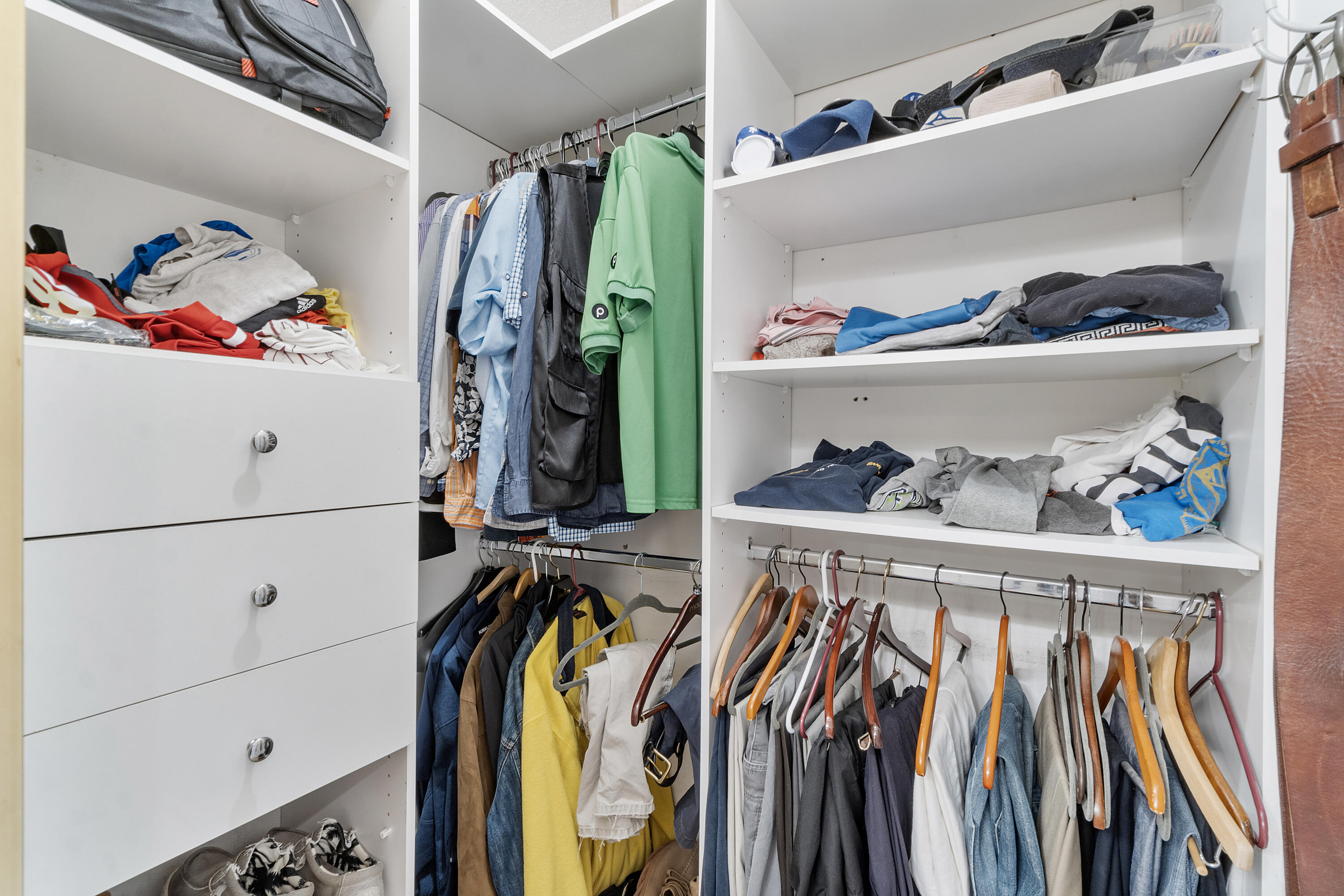 10900 Waterberry Court Boca Raton, FL 33498 - Photo 20 of 28 a view of walk in closet with clothes and shoes