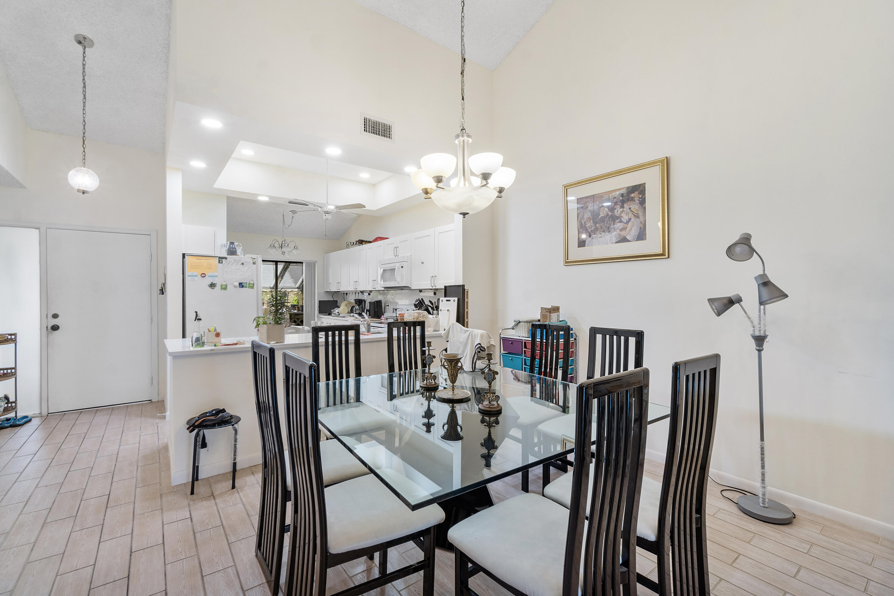 10900 Waterberry Court Boca Raton, FL 33498 - Photo 7 of 28 a view of a dining room with furniture and wooden floor