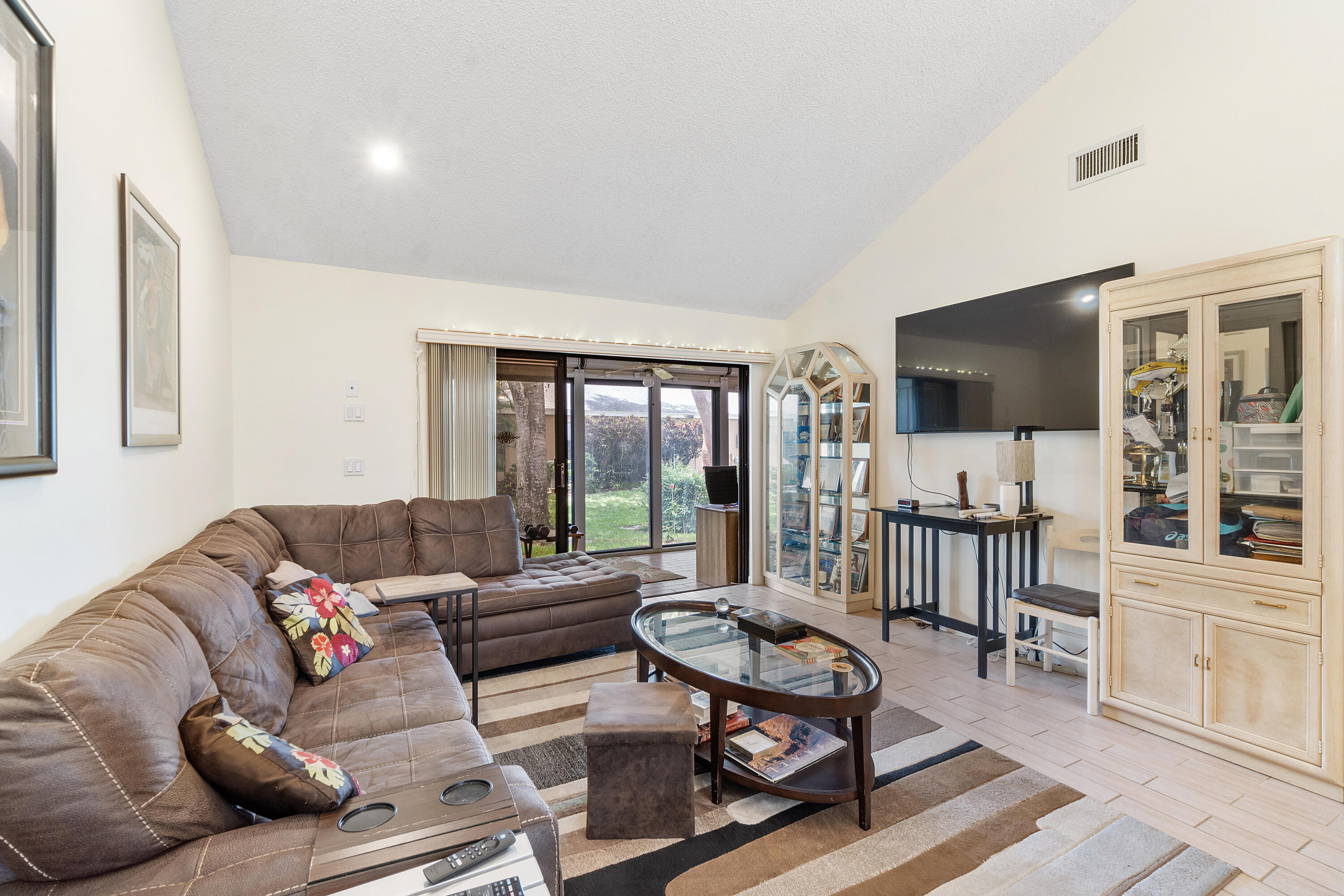 10900 Waterberry Court Boca Raton, FL 33498 - Photo 8 of 28 a living room with furniture and a flat screen tv