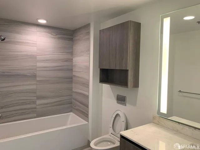 a bathroom with a sink a toilet and a bathtub