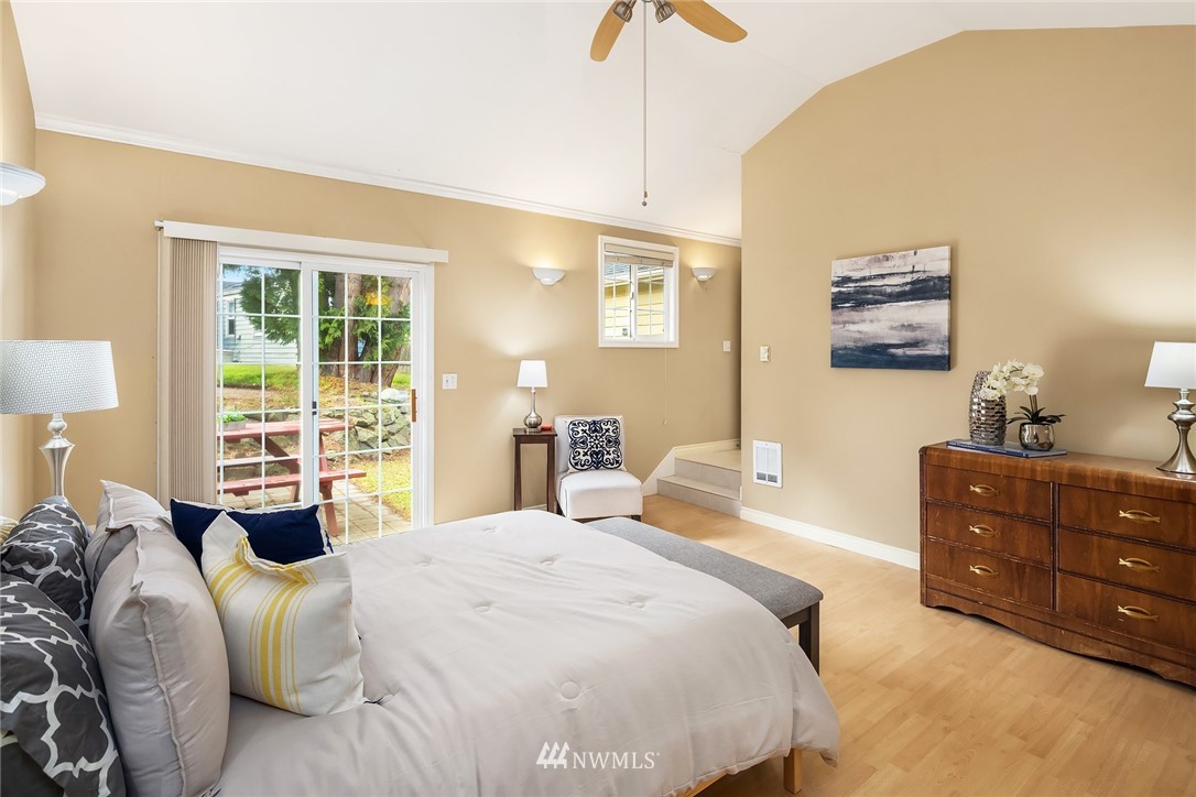 458 Grandey Way Northeast Renton, WA 98056 - Photo 13 of 18 a bedroom with a bed and wooden floor