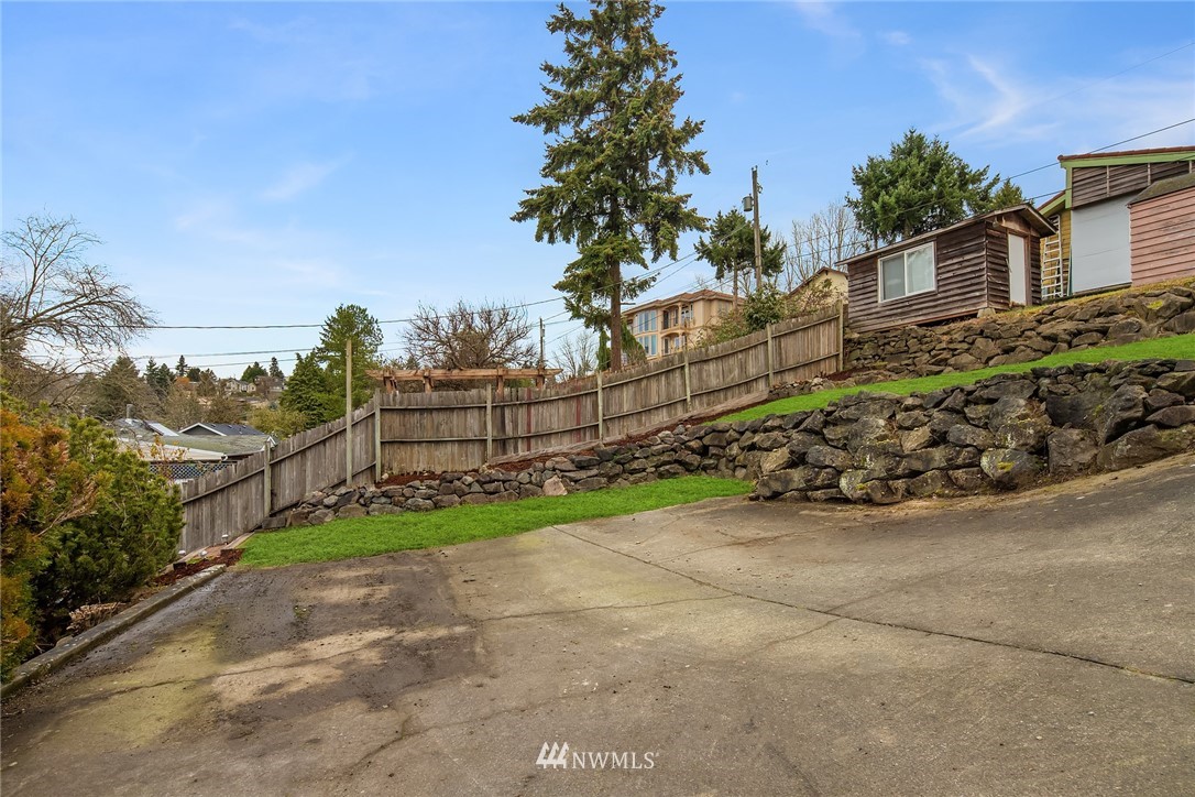 458 Grandey Way Northeast Renton, WA 98056 - Photo 16 of 18 a view of a garden with wooden fence