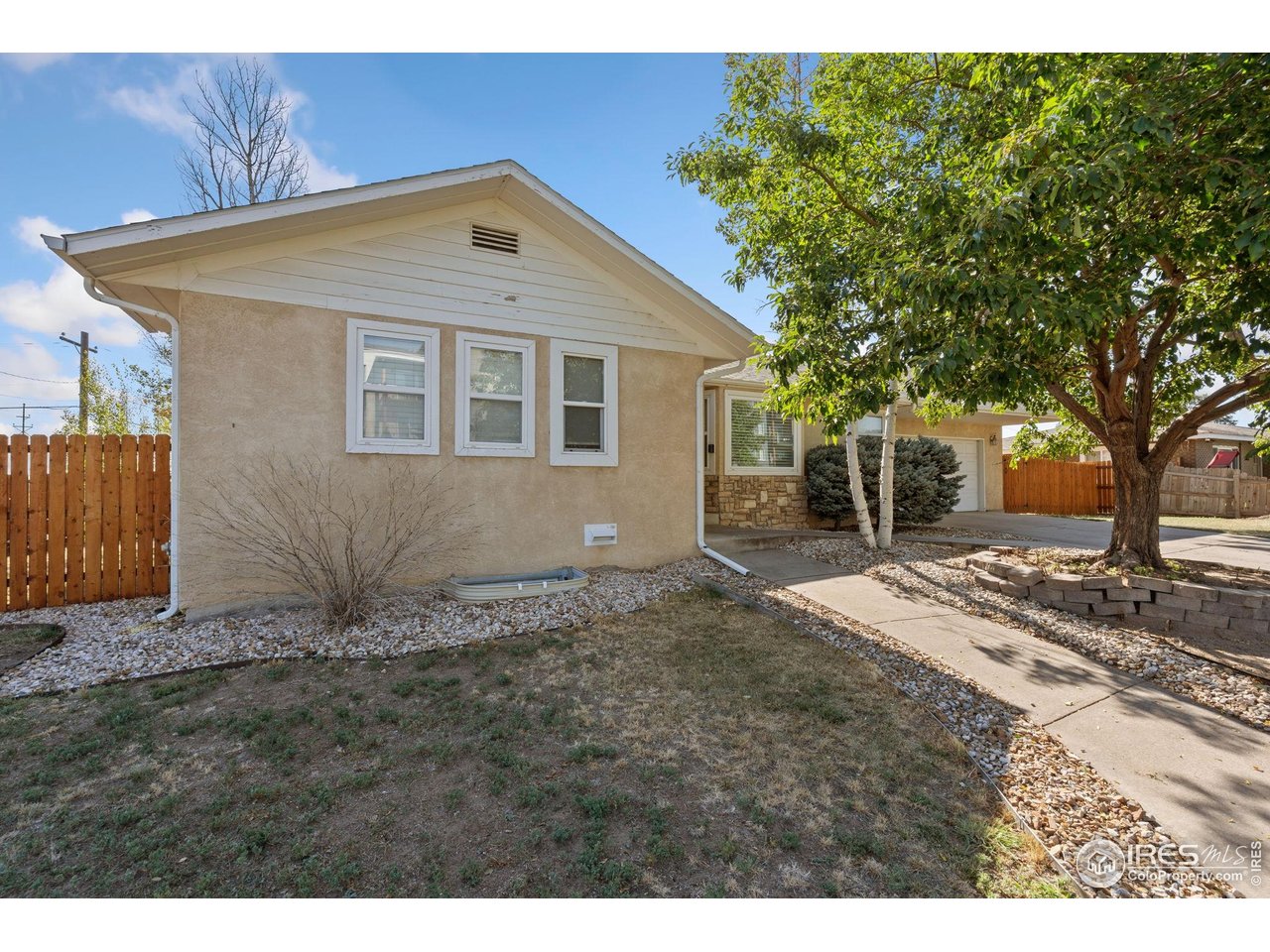 2000 50th Avenue Greeley, CO 80634 - Photo 1 of 34 a front view of a house with a yard