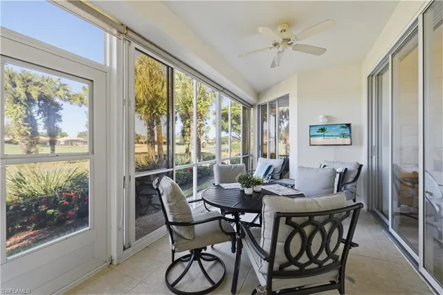 a dining room with furniture window and outside view