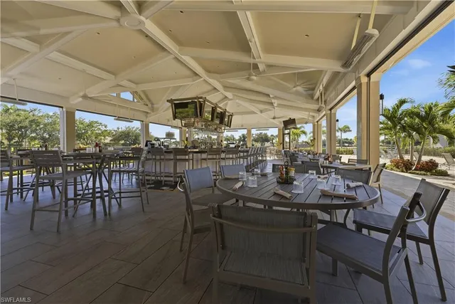 a view of a dining room with furniture window and outside view