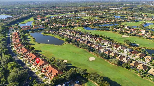 an aerial view of residential houses with outdoor space