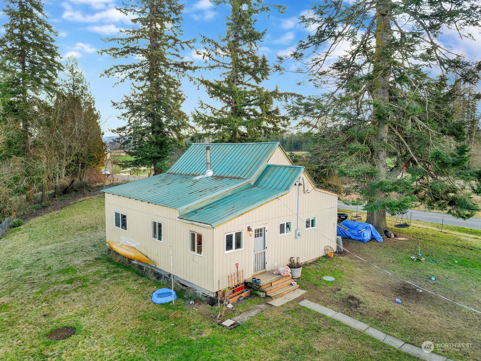 3534 Arnie Road Custer, WA 98240 - Photo 3 of 34 a white house covered with tall trees