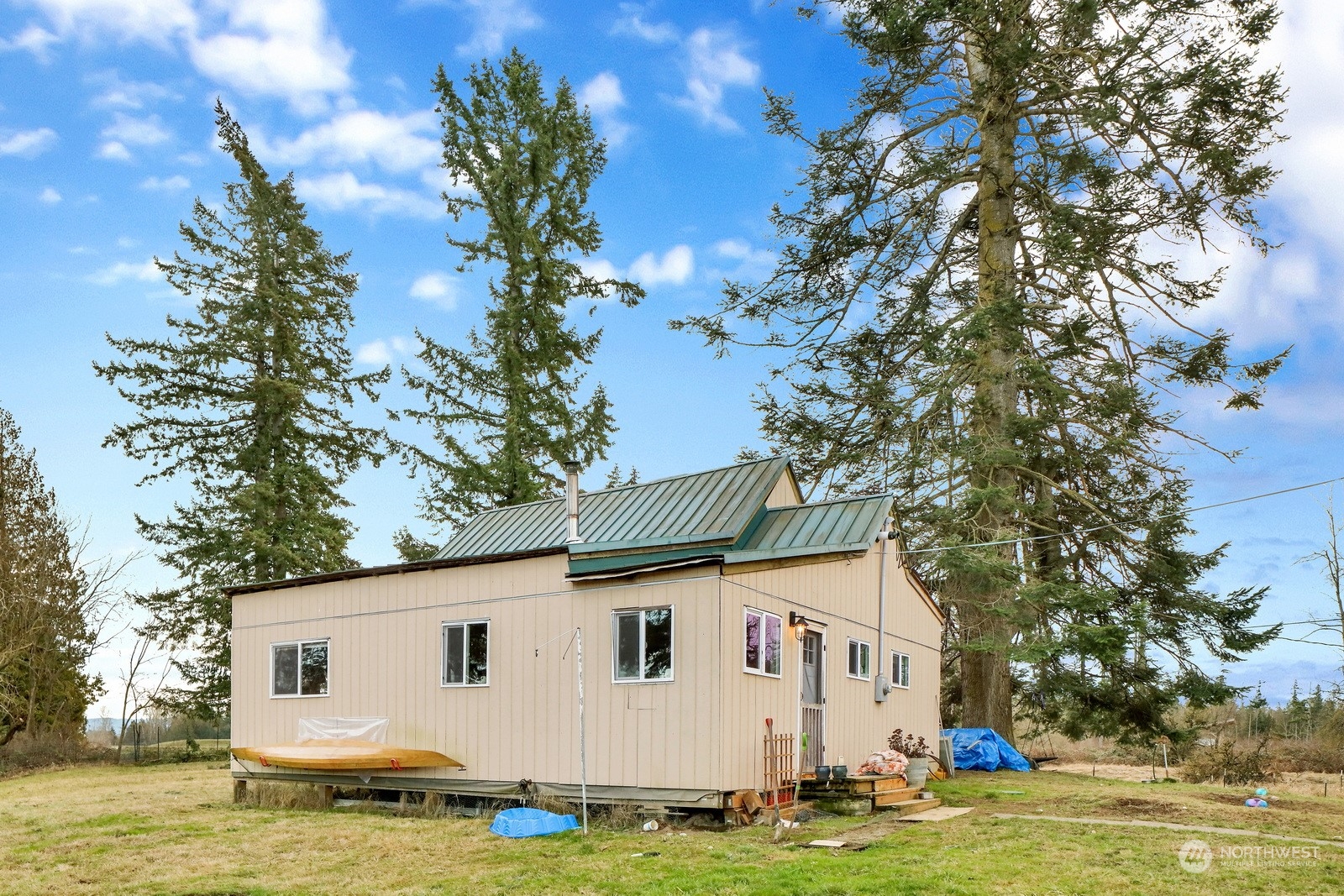 3534 Arnie Road Custer, WA 98240 - Photo 6 of 34 a view of a white house with a big yard