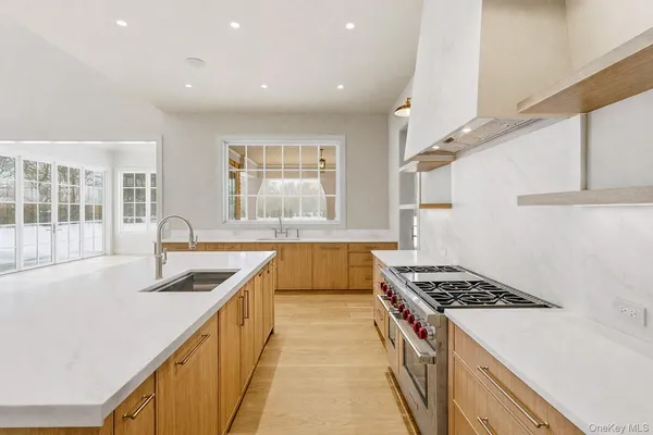 a kitchen that has a sink and a stove