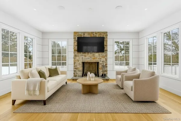 a living room with furniture and a fireplace