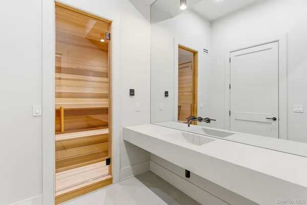 a bathroom with a sink and a mirror