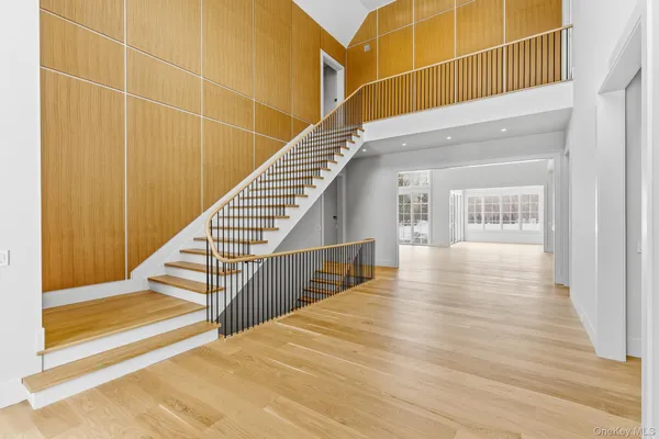 a view of an entryway with wooden floor