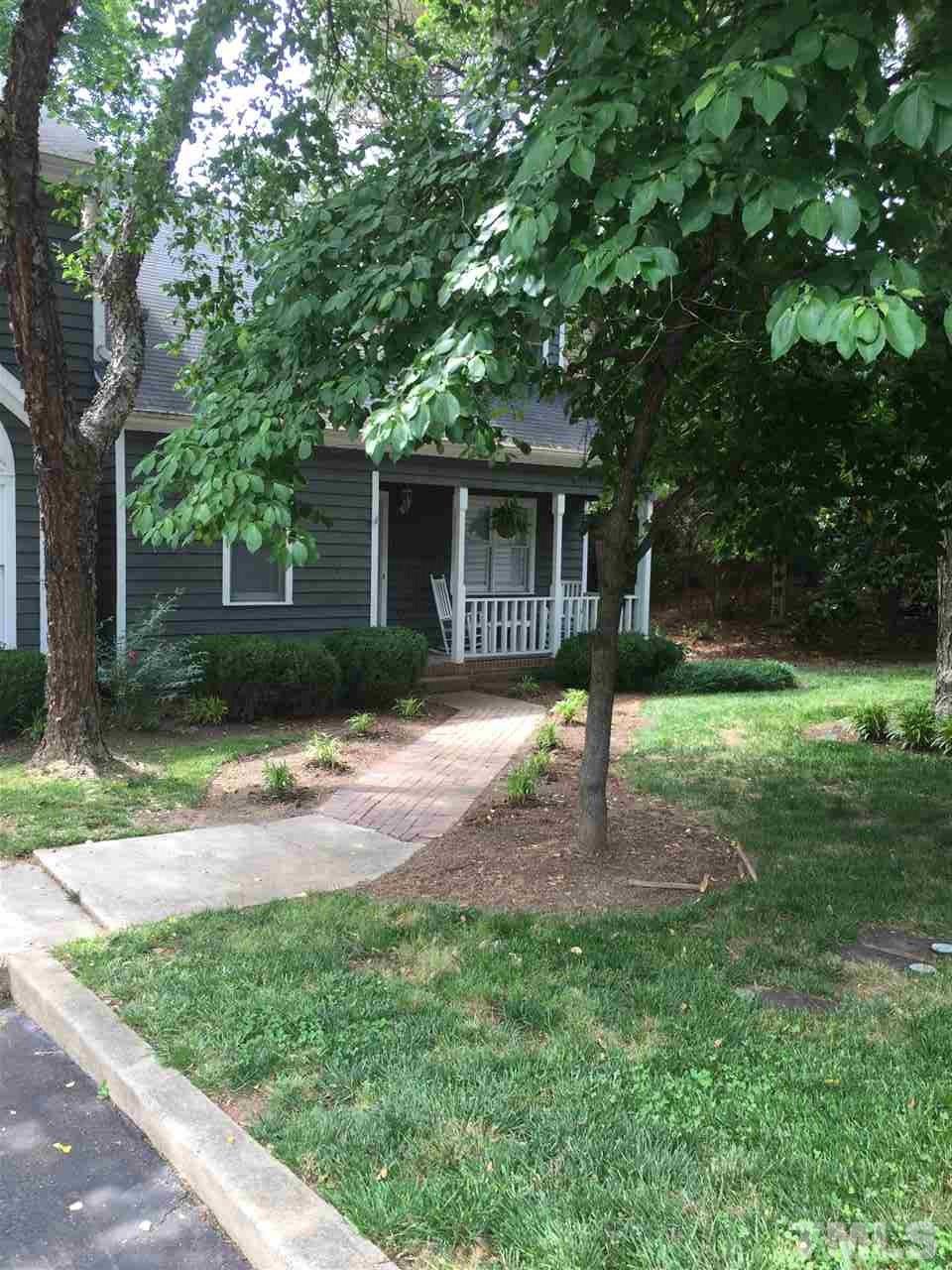 1439 Quarter Point Raleigh, NC 27615 - Photo 1 of 14 a house with garden in front of it