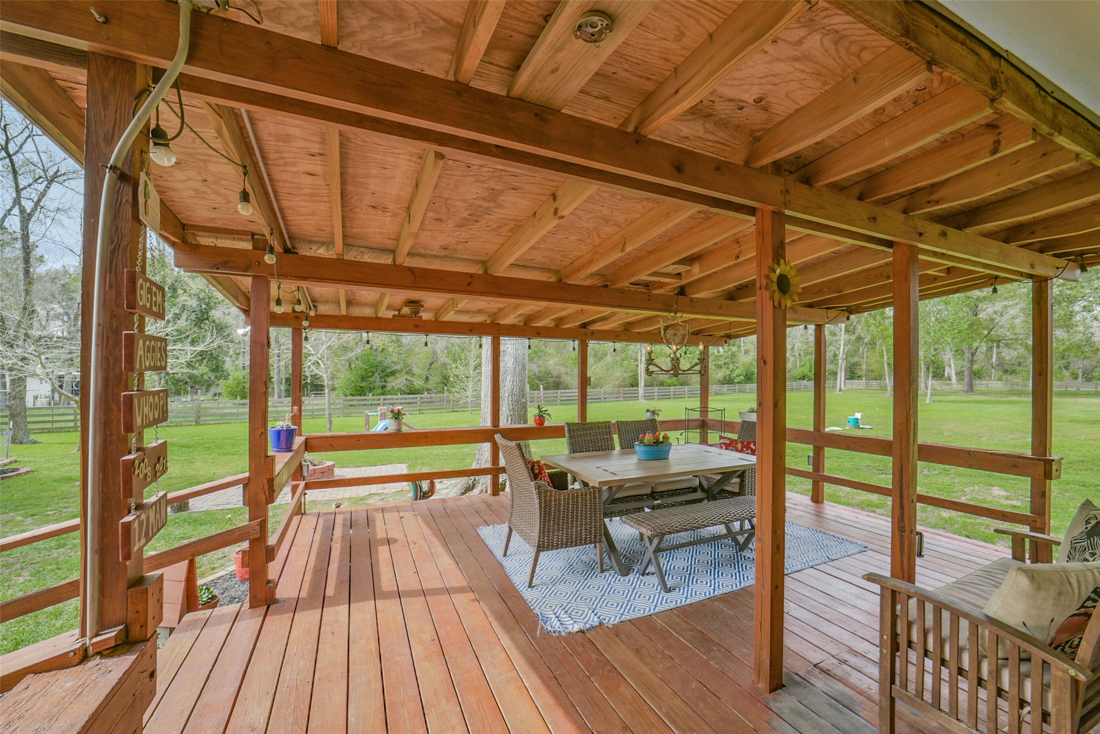 10313 South Williams Road Conroe, TX 77303 - Photo 34 of 48 Imagine the dinners on this back porch with decorative chandelier.