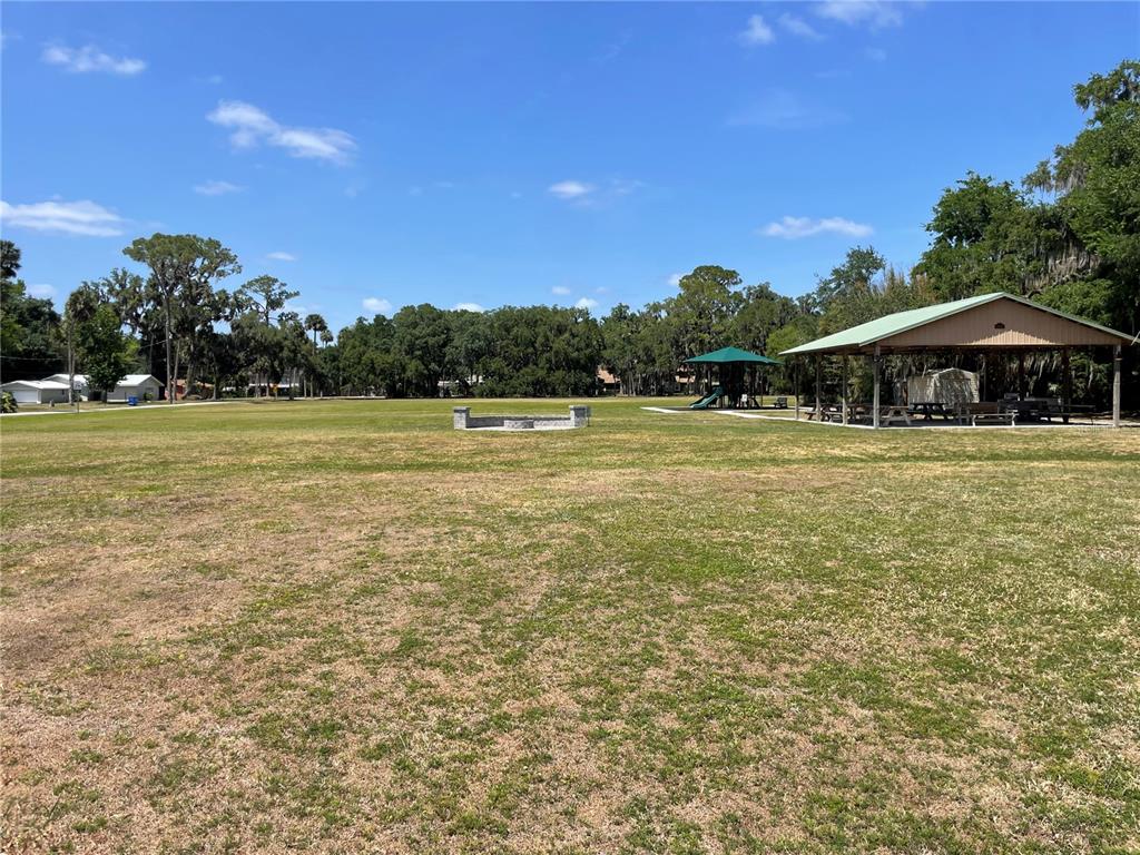 1496 Kettledrum Trail Deltona, FL 32725 - Photo 9 of 11 a view of a swimming pool and a yard