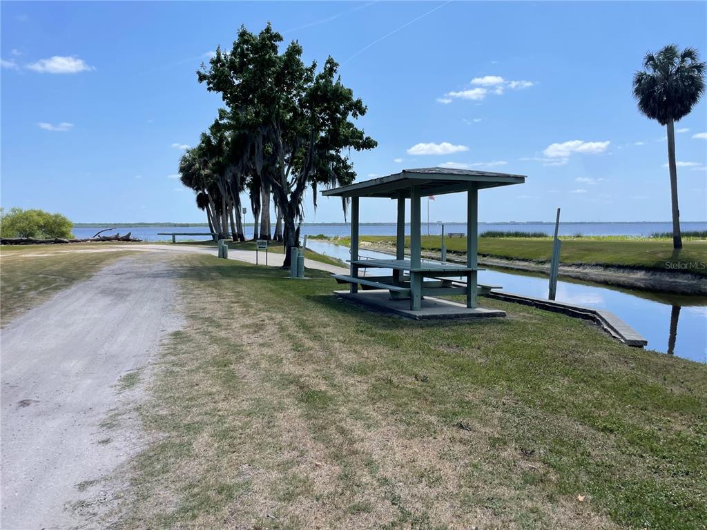 1496 Kettledrum Trail Deltona, FL 32725 - Photo 10 of 11 a backyard of a house with table and chairs