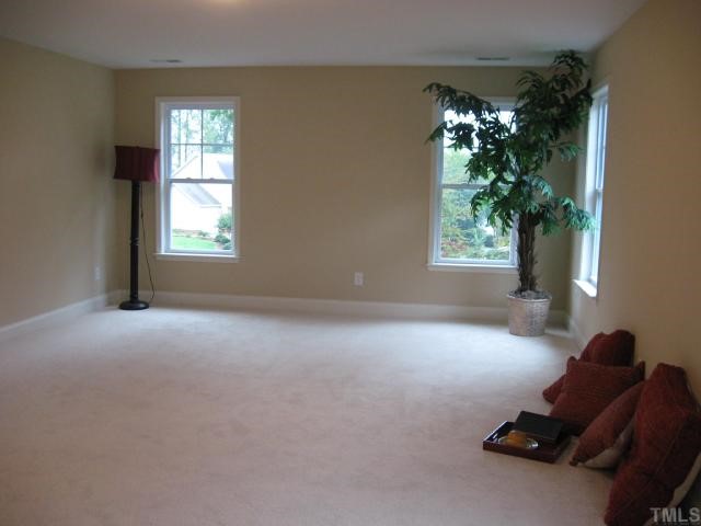 5810 Spring Glen Lane Raleigh, NC 27616 - Photo 11 of 12 a view of livingroom with a window and a potted plant