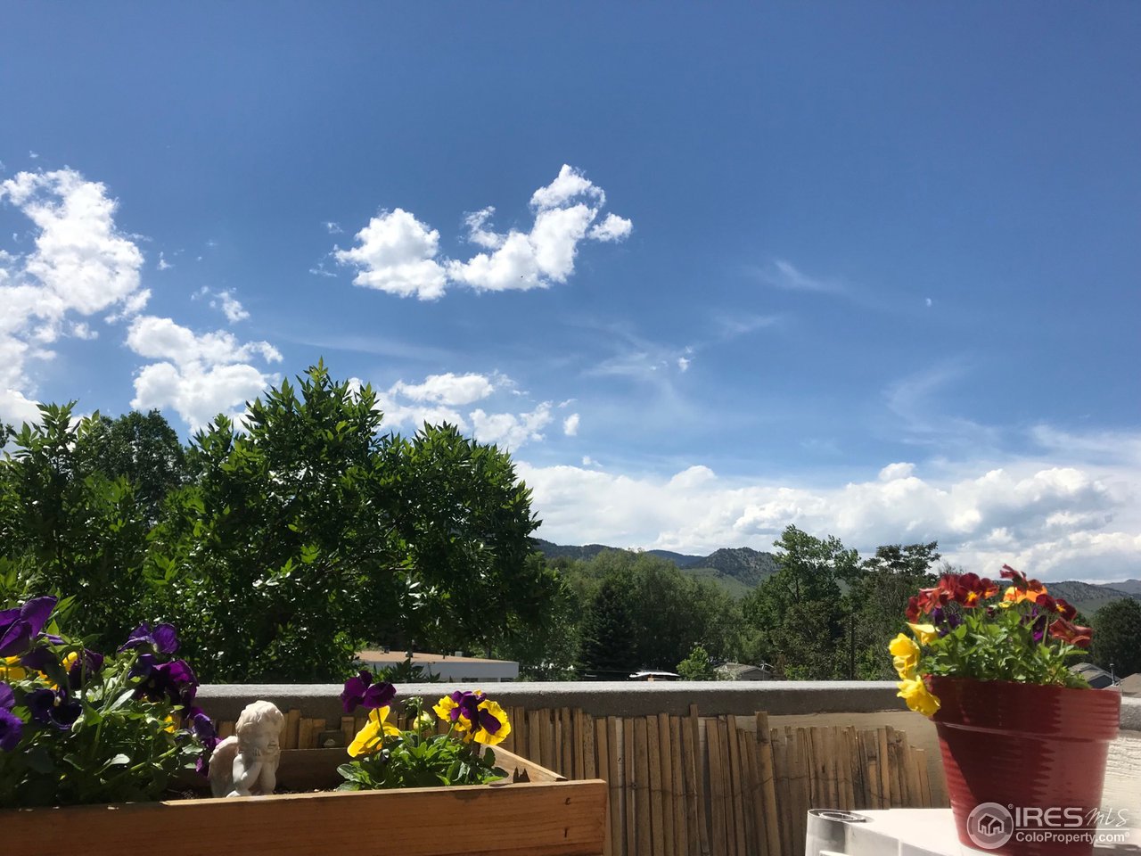 2711 Mapleton Avenue, Unit 27 Boulder, CO 80304 - Photo 12 of 13 a view of a fountain with a flower in it