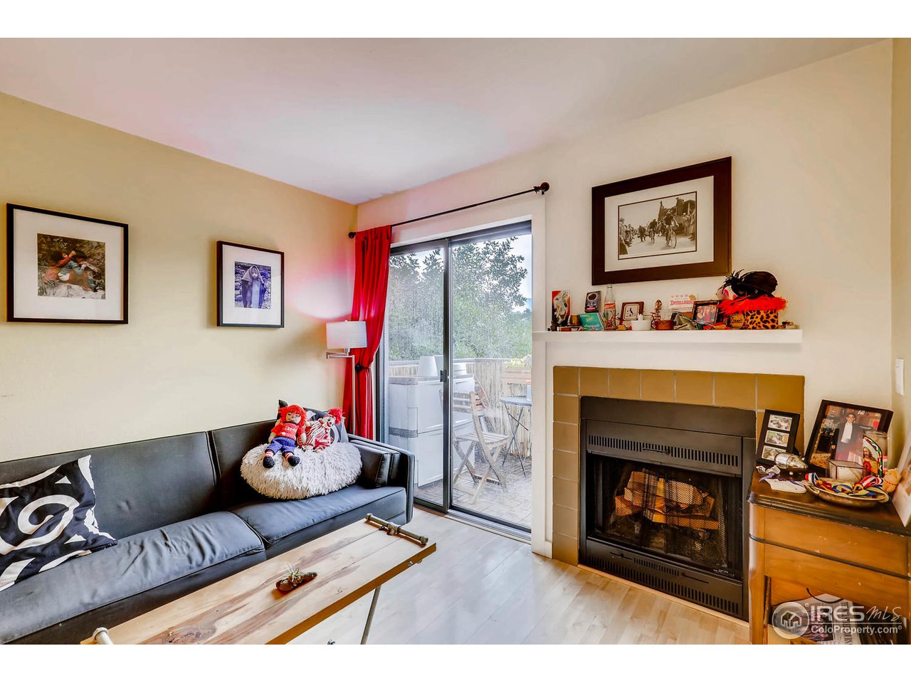 2711 Mapleton Avenue, Unit 27 Boulder, CO 80304 - Photo 4 of 13 a living room with furniture and a fireplace