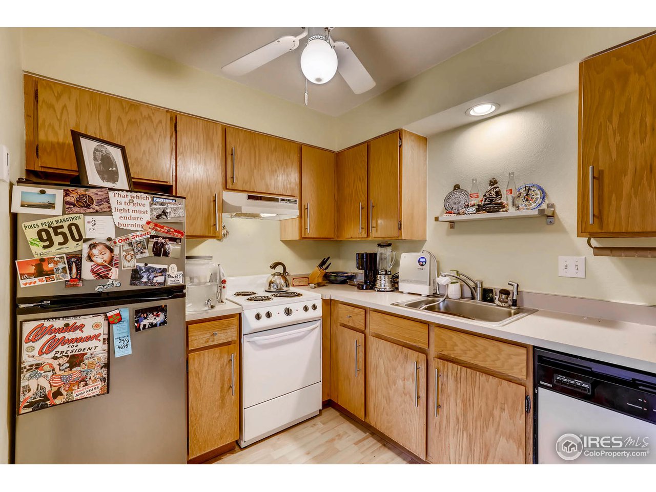 2711 Mapleton Avenue, Unit 27 Boulder, CO 80304 - Photo 5 of 13 a kitchen with stainless steel appliances a sink stove and cabinets