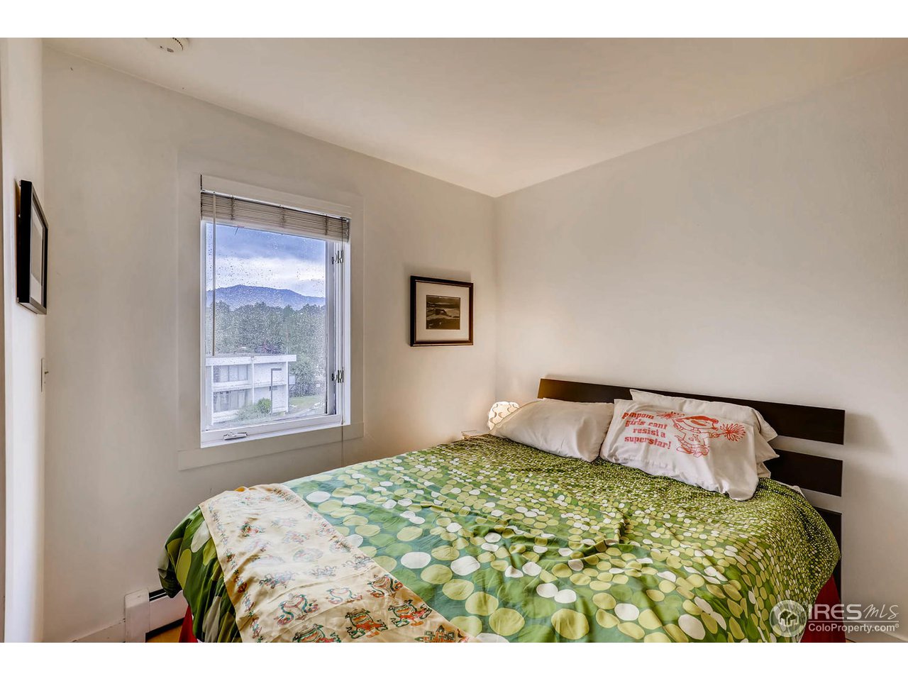 2711 Mapleton Avenue, Unit 27 Boulder, CO 80304 - Photo 8 of 13 a bedroom with a bed and a window