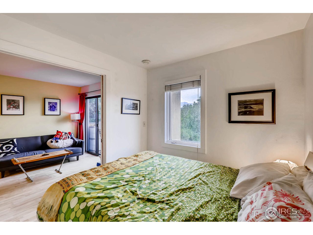 2711 Mapleton Avenue, Unit 27 Boulder, CO 80304 - Photo 9 of 13 a bedroom with a bed and a couch