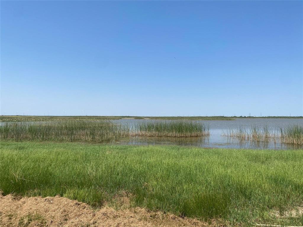 25 &26 Edgewater Beach Club Haskell, TX 79521 - Photo 2 of 7 a view of a lake with a yard