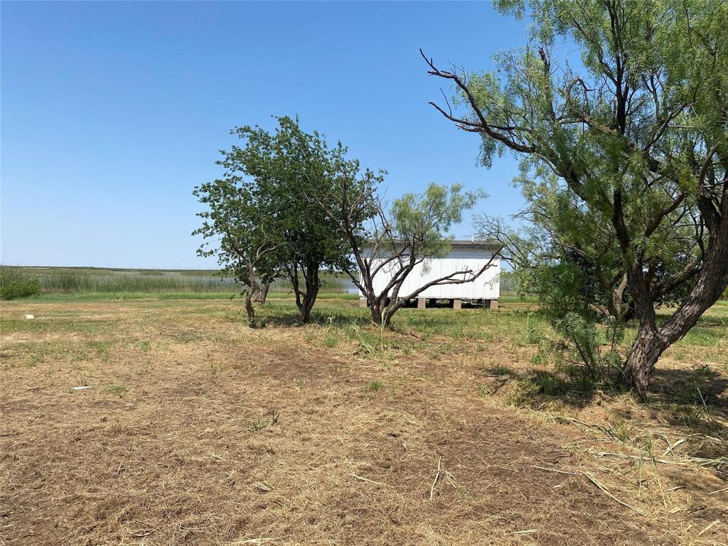 25 &26 Edgewater Beach Club Haskell, TX 79521 - Photo 7 of 7 a front view of a house with a yard