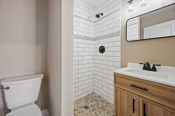 5 Monmouth Street Boston, MA 02128 - Photo 37 of 40 a bathroom with a sink a toilet and shower