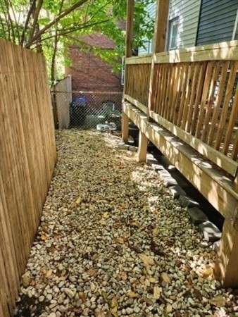 5 Monmouth Street Boston, MA 02128 - Photo 6 of 40 a view of a backyard with wooden fence