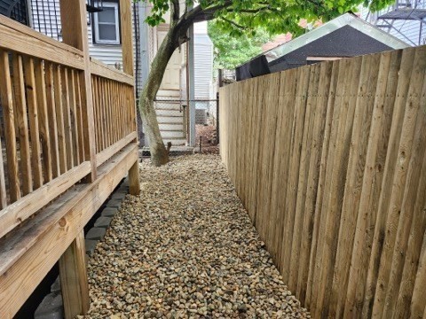 5 Monmouth Street Boston, MA 02128 - Photo 8 of 40 a view of a pathway of a house with wooden fence