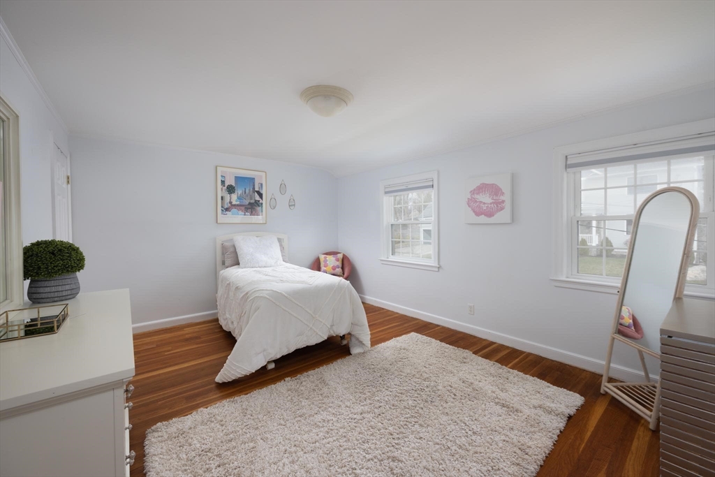 10 Kendall Road Newton, MA 02459 - Photo 12 of 21 a bedroom with a bed and wooden floor