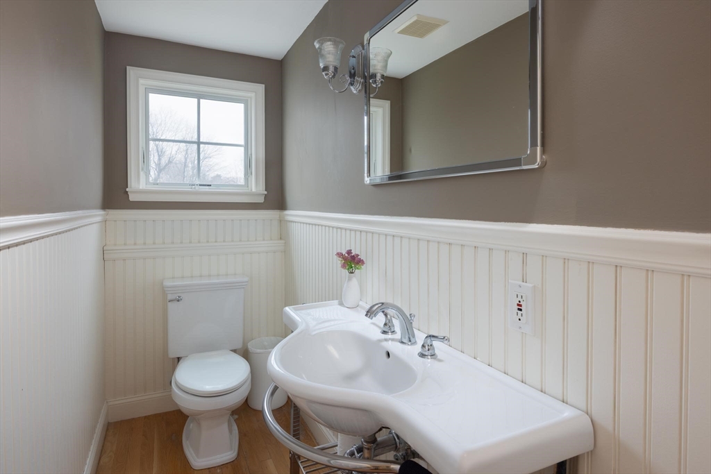 10 Kendall Road Newton, MA 02459 - Photo 8 of 21 a bathroom with a sink toilet and mirror