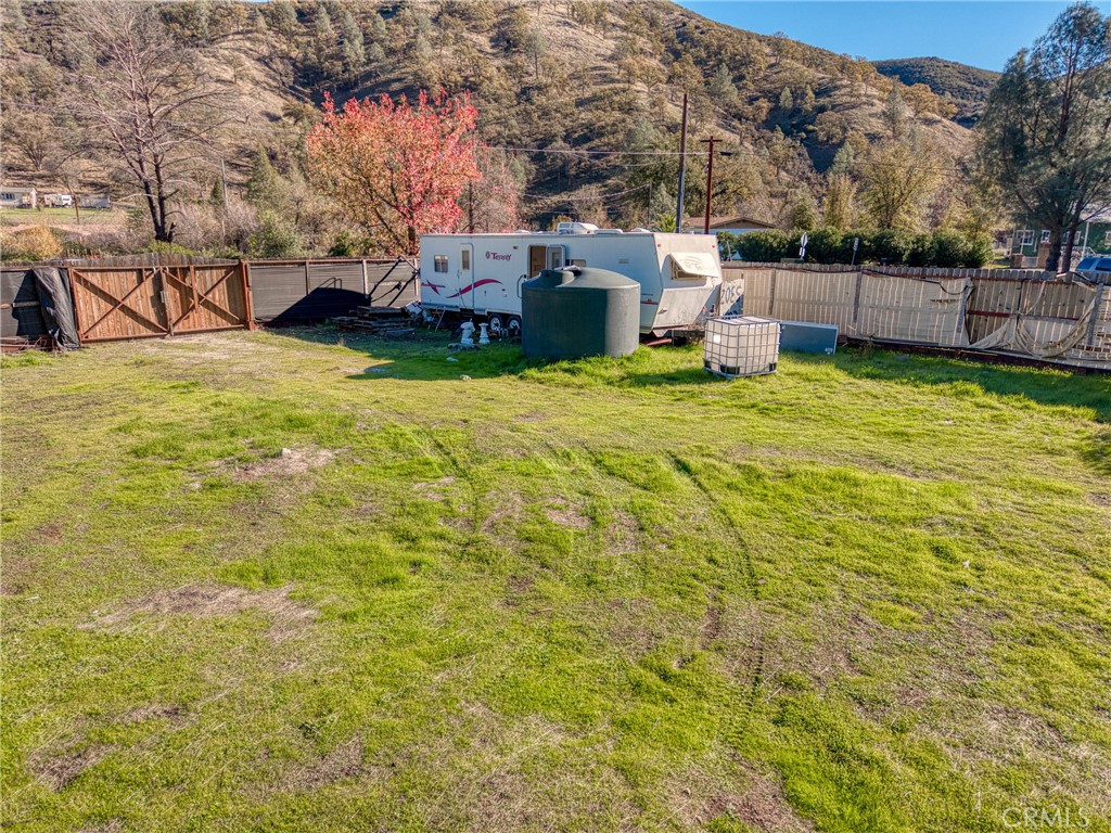 3865 Spring Valley Road Clearlake Oaks, CA 95423 - Photo 12 of 20 a view of a swimming pool with a bench