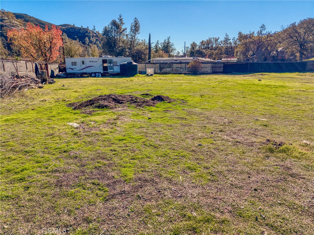 3865 Spring Valley Road Clearlake Oaks, CA 95423 - Photo 15 of 20 a view of a swimming pool with an outdoor space and seating area