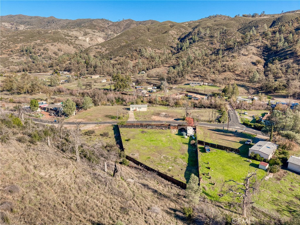 3865 Spring Valley Road Clearlake Oaks, CA 95423 - Photo 16 of 20 a view of a pool with a mountain in the background