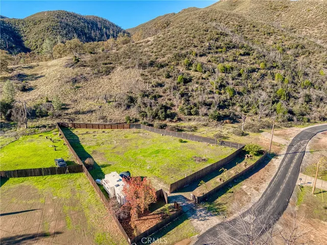 a view of a swimming pool with a yard