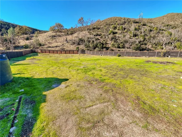 a view of a large building with mountains in the background