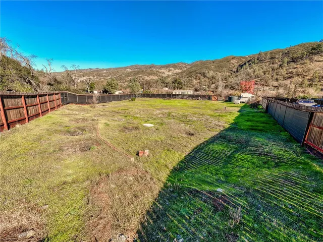a view of a yard with a lake view