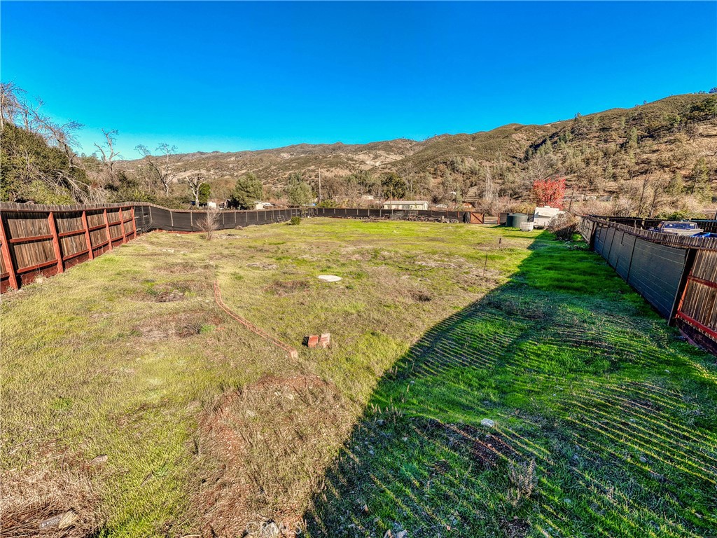 3865 Spring Valley Road Clearlake Oaks, CA 95423 - Photo 10 of 20 a view of a yard with a lake view