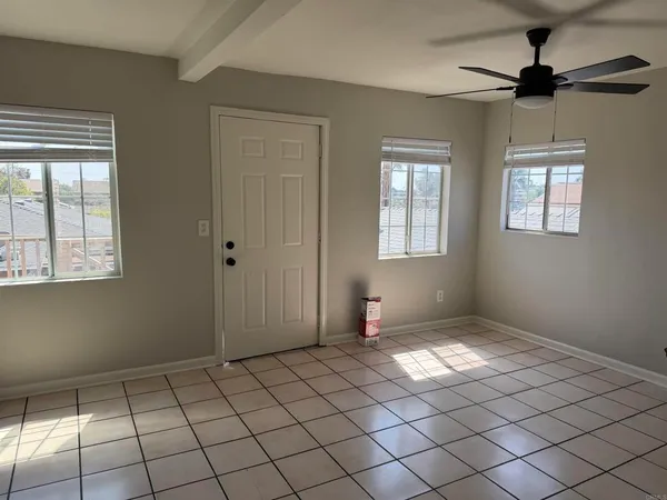 a view of an empty room and window