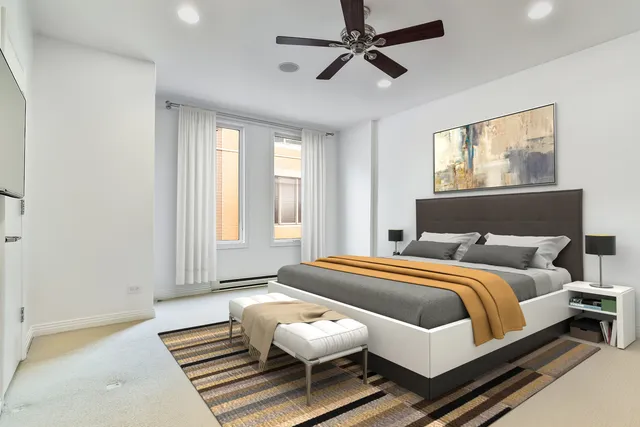 a bedroom with a bed and window