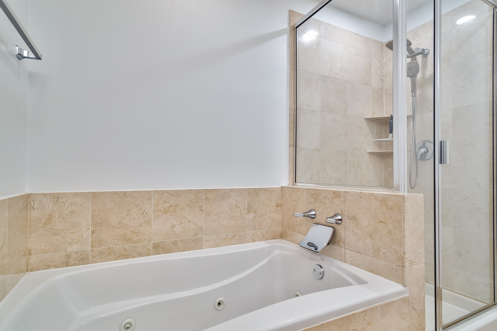 849 West Ohio Street, Unit 8 Chicago, IL 60642 - Photo 6 of 20 a bathroom with a bathtub and shower