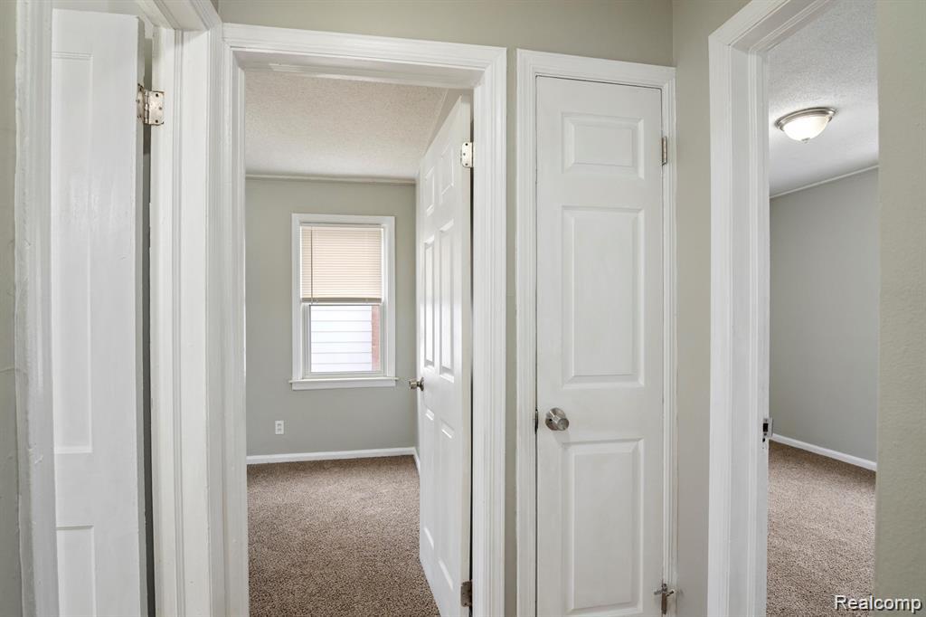285 Campbell Street River Rouge, MI 48218 - Photo 12 of 33 Hallway featuring carpet flooring and a textured ceiling